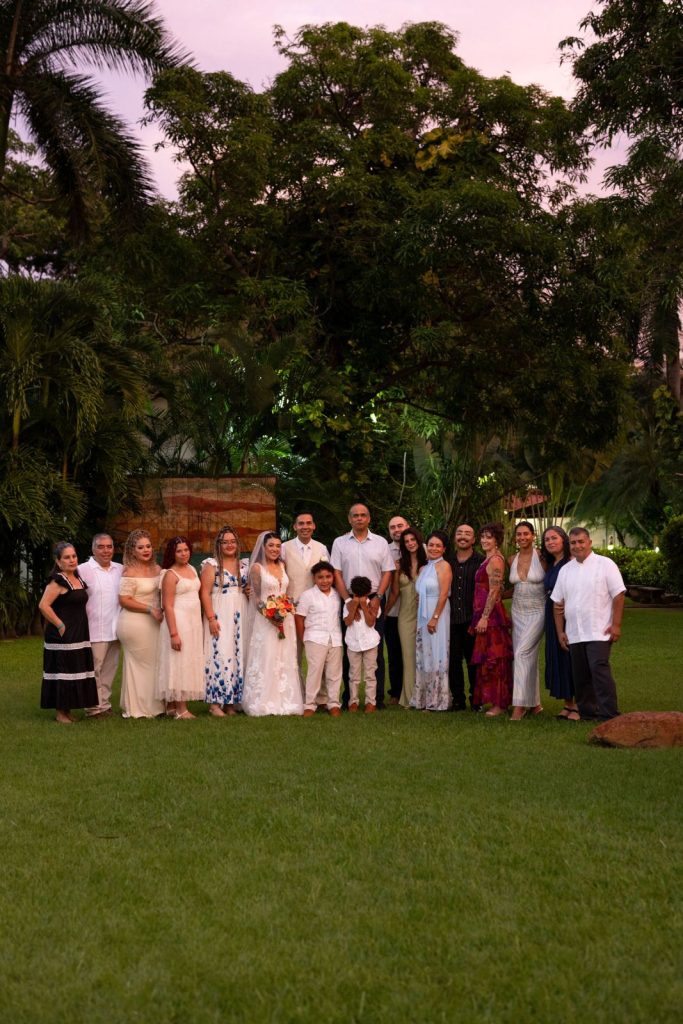 Group photo of an intimate wedding with family and friends at Oscar's Puerto Vallarta