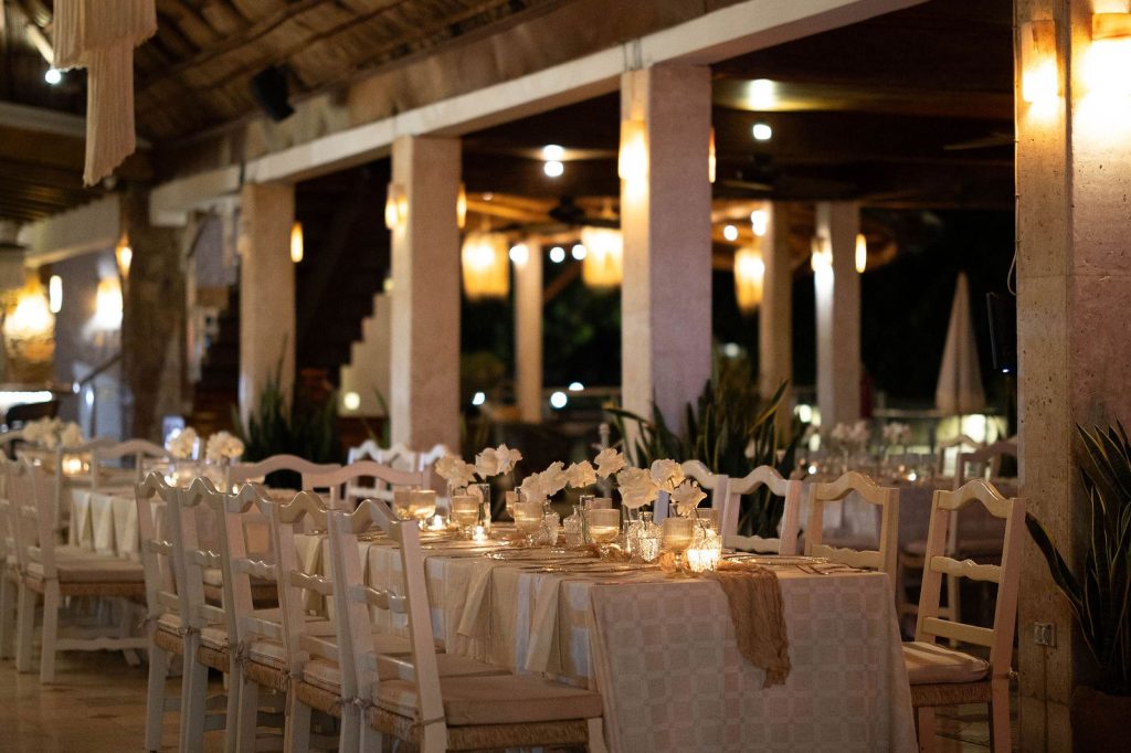 Event space set for a wedding reception at night at Oscar's in Puerto Vallarta
