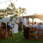 Garden wedding ceremony at sunset with string lights and palm trees at Oscar's in Puerto Vallarta
