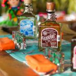 Grand Bay tequila bottles on a tasting table at Oscar's distillery in Puerto Vallarta