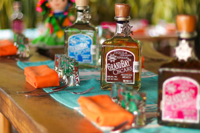 Grand Bay tequila bottles on a tasting table at Oscar's distillery in Puerto Vallarta