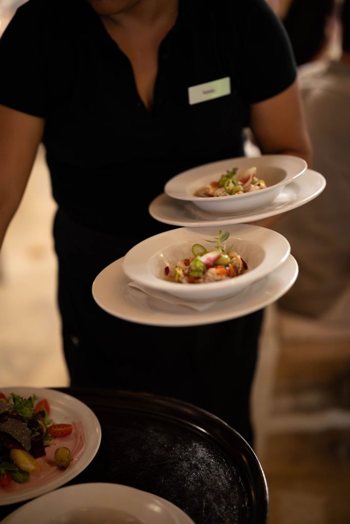 Waiter serving ceviche to wedding guests at Oscar's Puerto Vallarta